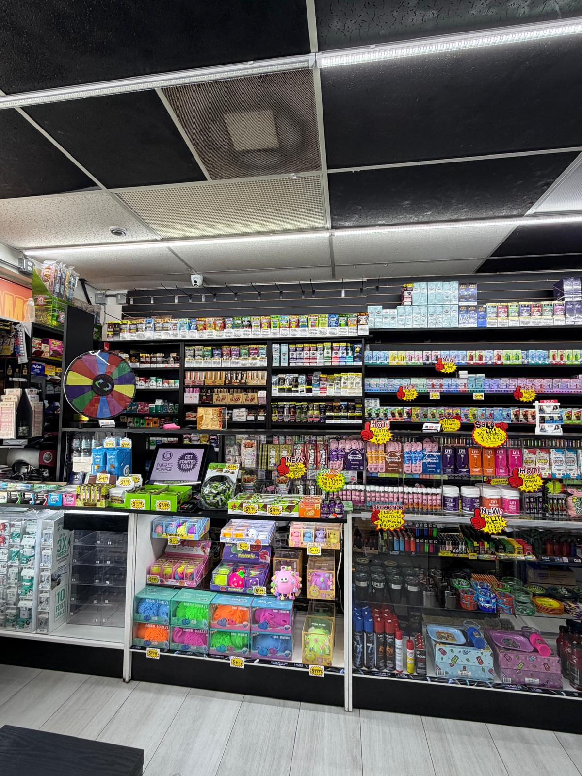 Disposable vape wall and cigarillo display at One Stop Market N Smoke Shop in Hialeah, FL.